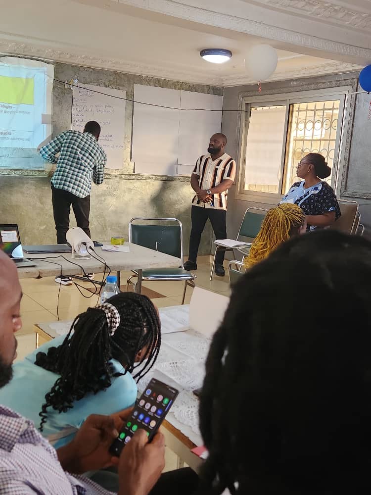 A facilitator leading a participatory research and planning discussion.
