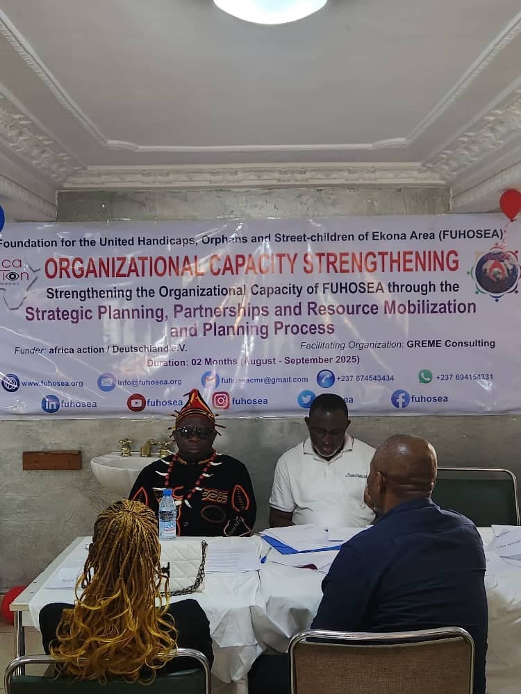 Project stakeholders reviewing evaluation materials during a participatory workshop.