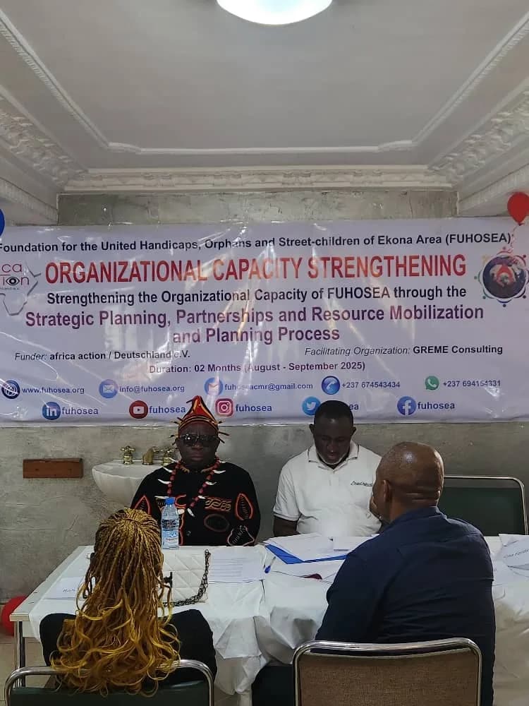 Project stakeholders reviewing evaluation materials during a participatory workshop.