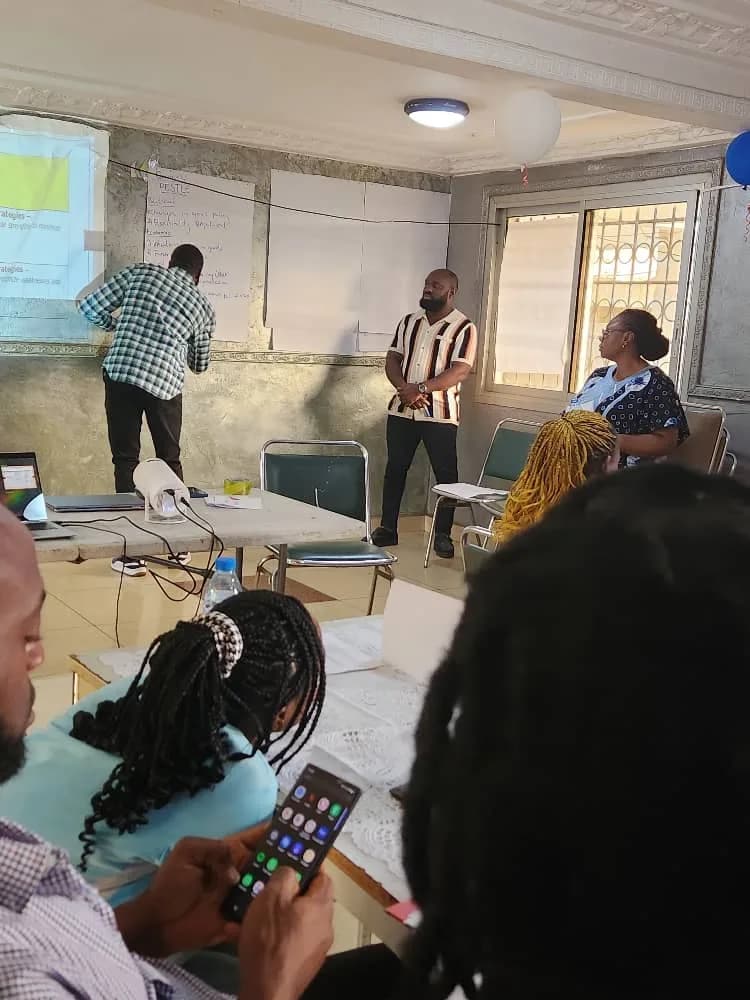 A facilitator leading a participatory research and planning discussion.